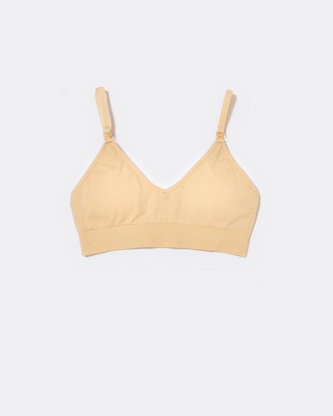 SASSH Essential Bralette in Beige, front view, V-neck triangle style with ribbed underband and bow strap detail