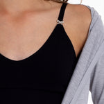 Close-up of a black SASSH Essential training bra showing bow strap detail and seamless underband — girls seamless training bra, first bra.