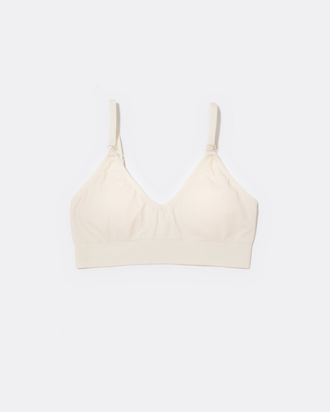 SASSH Essential Bralette in white, front view, V-neck triangle style with ribbed underband and bow strap detail