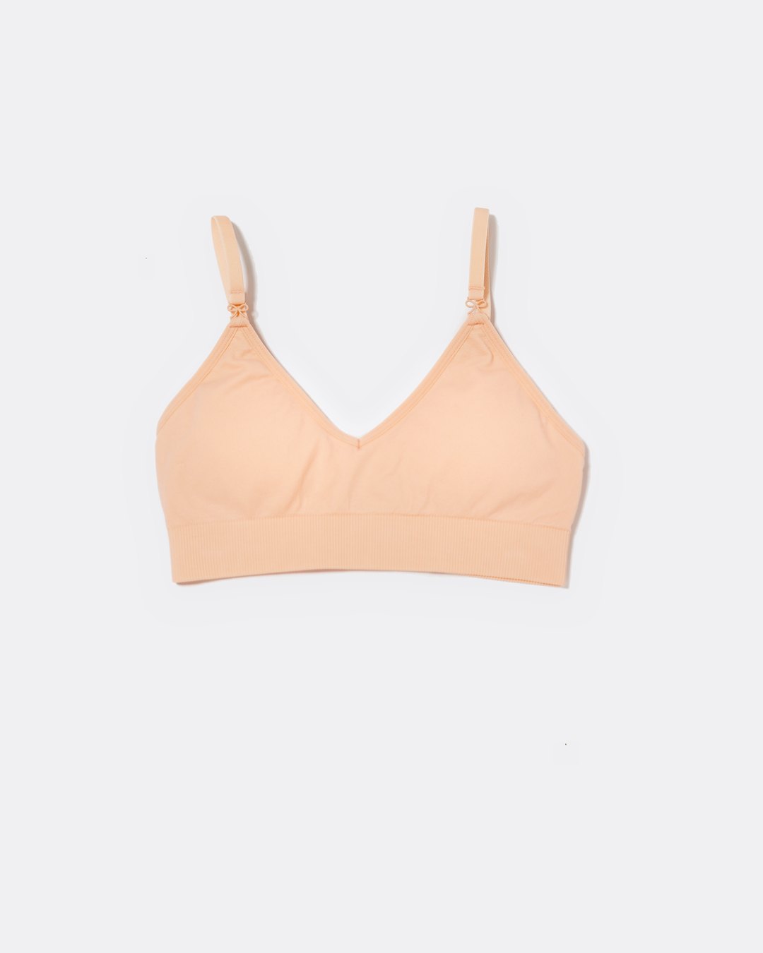 SASSH Essential Bralette in Peach, front view, V-neck triangle style with ribbed underband and bow strap detail