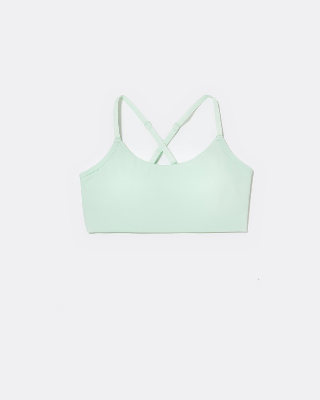 SASSH The Energy sports bra in mint green, front ghost view, smooth scoop neckline and seamless underband — girls sports bra for tweens.
