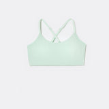 SASSH The Energy sports bra in mint green, front ghost view, smooth scoop neckline and seamless underband — girls sports bra for tweens.