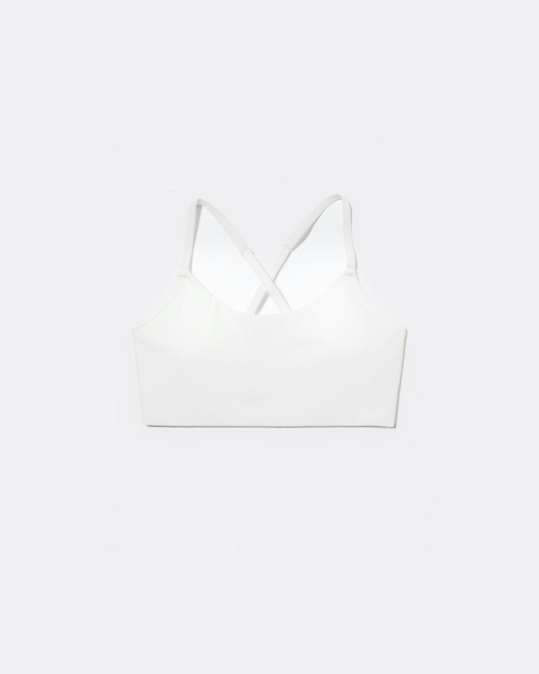 SASSH The Energy sports bra in white, front ghost view, smooth scoop neckline and seamless underband — girls sports bra for tweens.