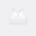 SASSH The Energy sports bra in white, front ghost view, smooth scoop neckline and seamless underband — girls sports bra for tweens.