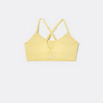 SASSH The Energy sports bra in yellow, back ghost view, showing crossover racerback strap detail — girls sports bra, first sports bra.
