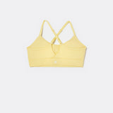 SASSH The Energy sports bra in yellow, back ghost view, showing crossover racerback strap detail — girls sports bra, first sports bra.